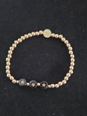 Marilyn Schiff Gold Beaded Stretch Bracelet with 3 Black Star Accent Beads